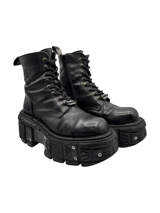 Pair of black lace-up platform ankle boots side-by-side, chunky tread soles