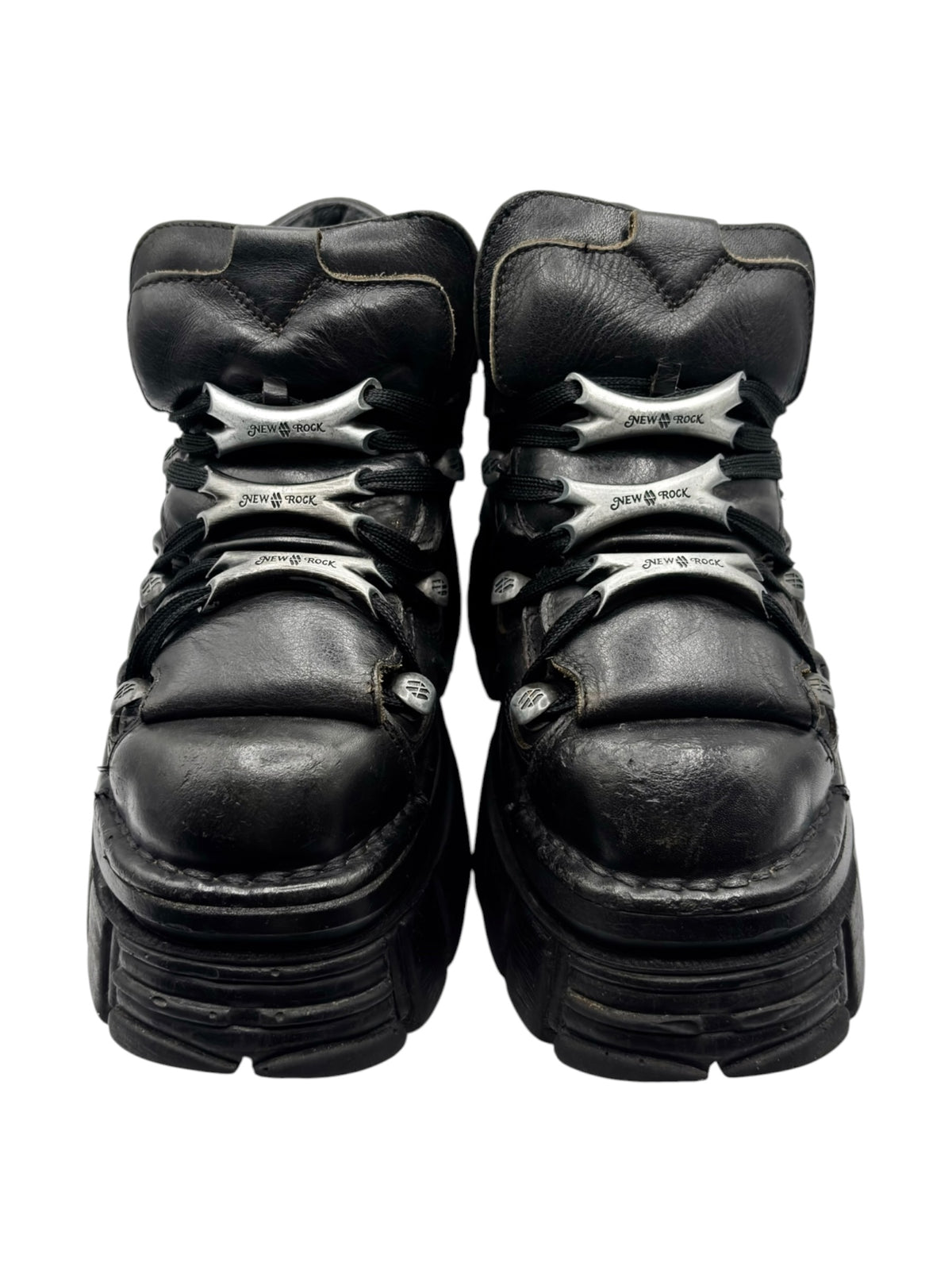 Black platform boots back view with contrast logo detail and heel tread