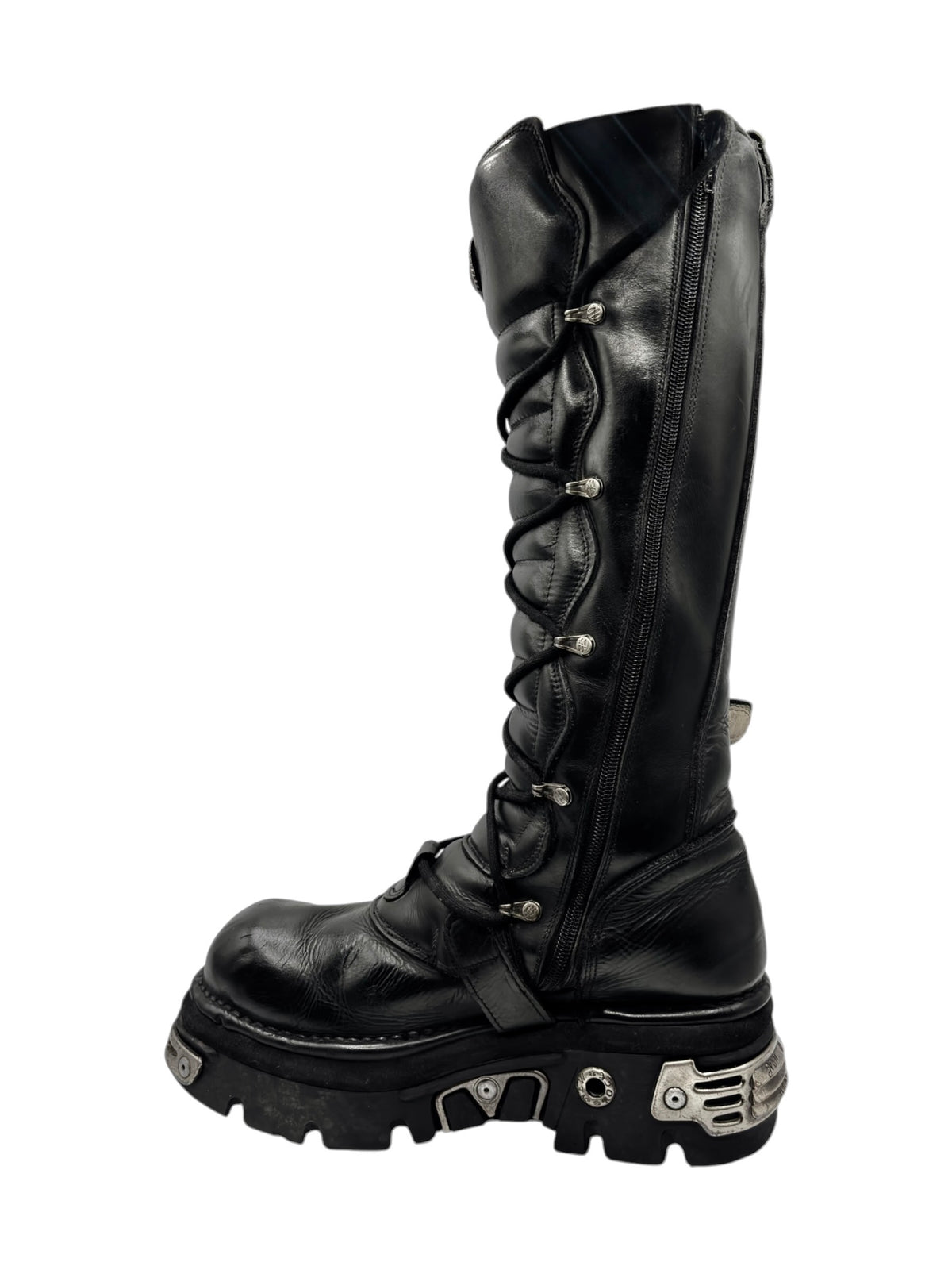 Knee-high black leather lace-up reactor boots with front straps and chunky platform sole