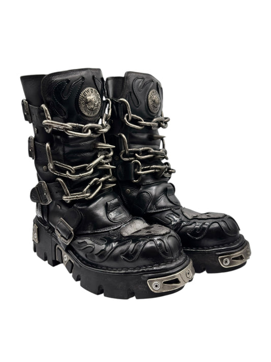 Black leather chained boots with round medallion eyelets and chain straps