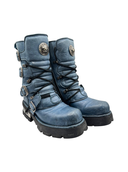 Blue leather mid-calf boots with lace-up front and side buckles, rugged tread sole.