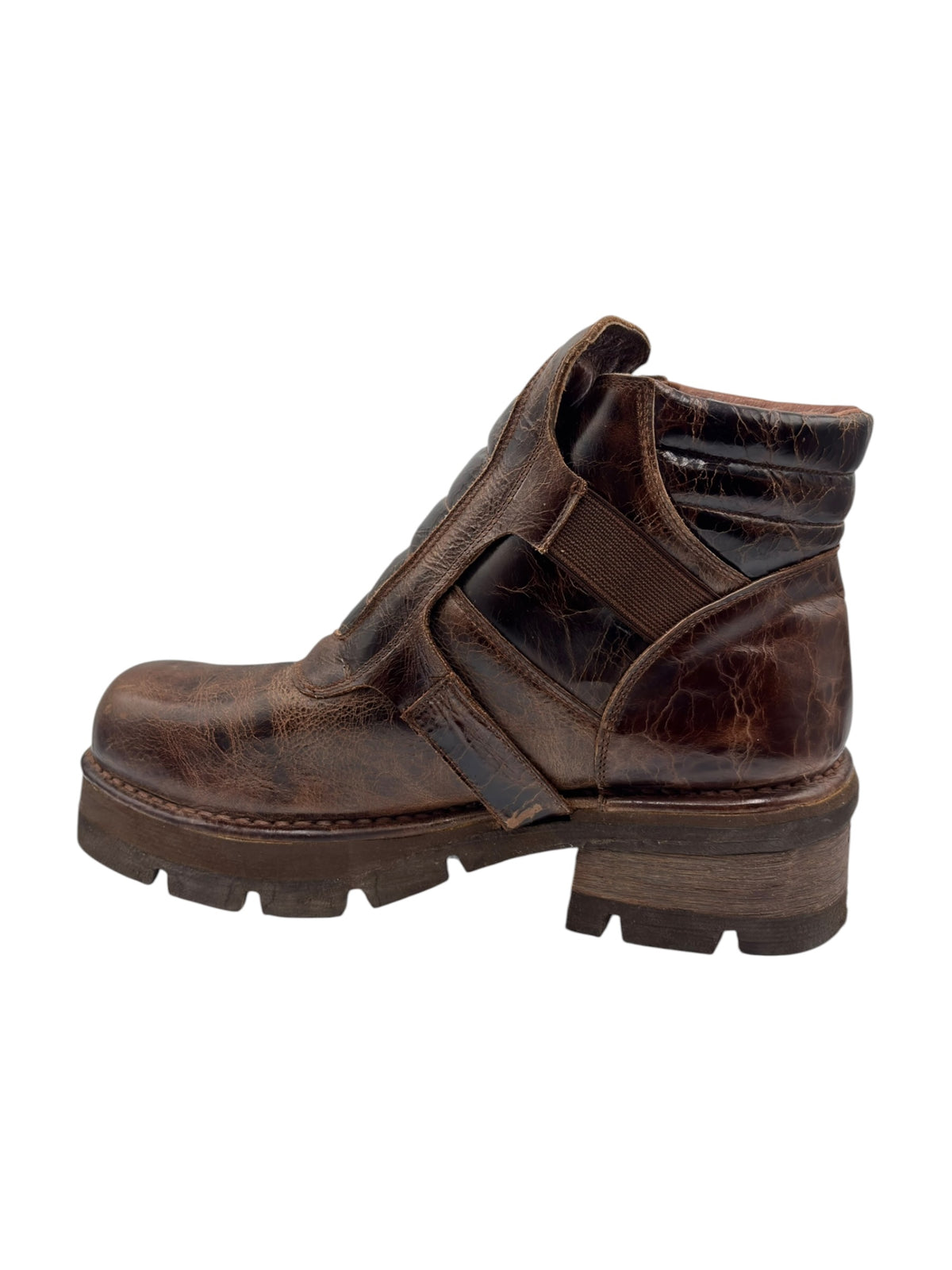 Brown leather boot with side strap, padded collar, and thick tread sole