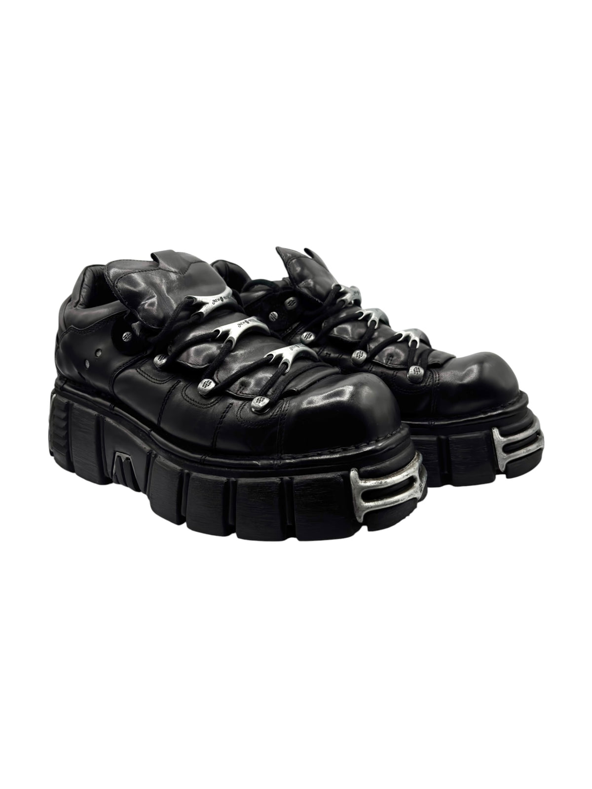 Black lace-up platform boots 3/4 view with oversized tread and eyelets
