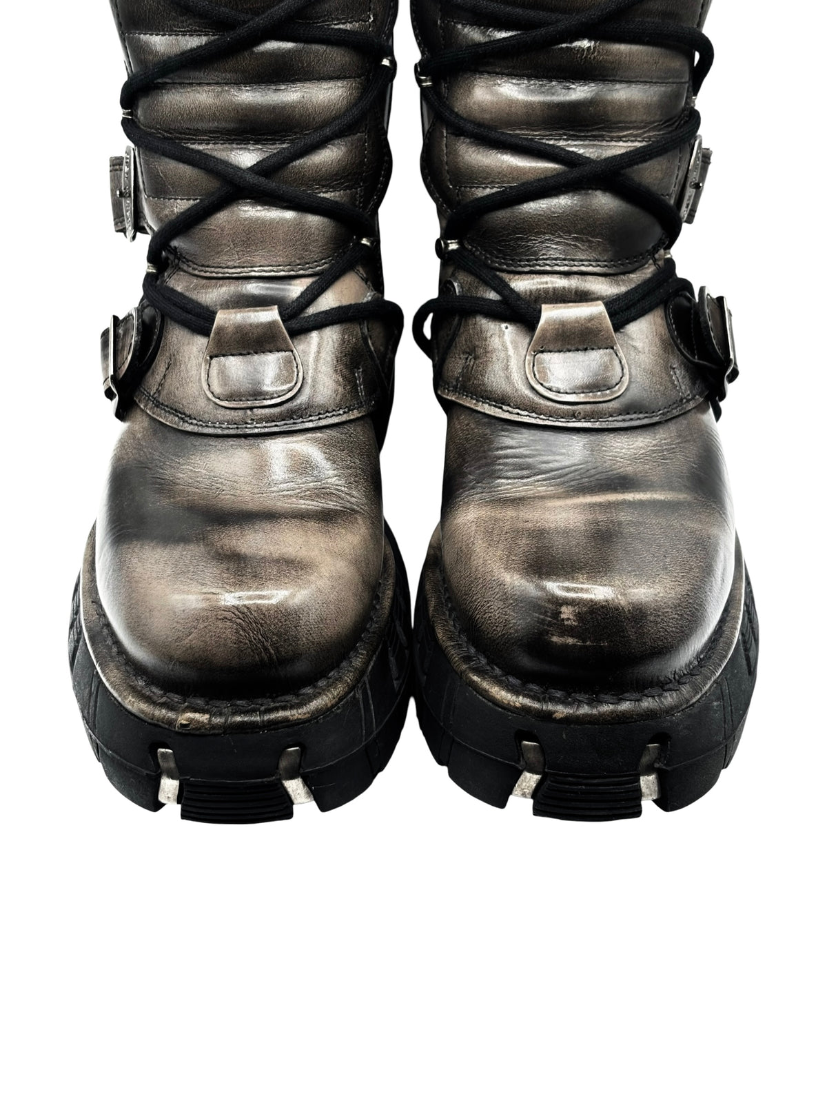 Vintage lace-up leather boots with buckles, metallic finish, and chunky black sole