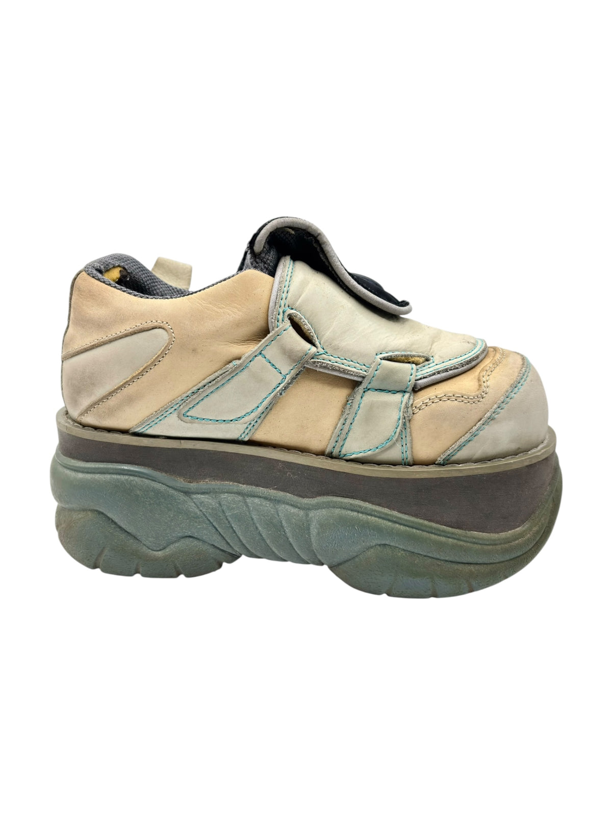 Light tan Swear platform boots with blue piping and thick green sole