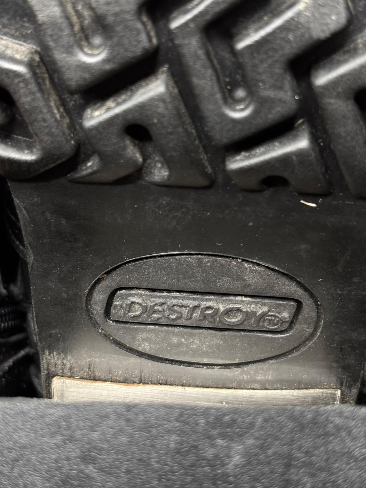Knee-high boot sole with 'DESTROY' logo and rugged tread pattern