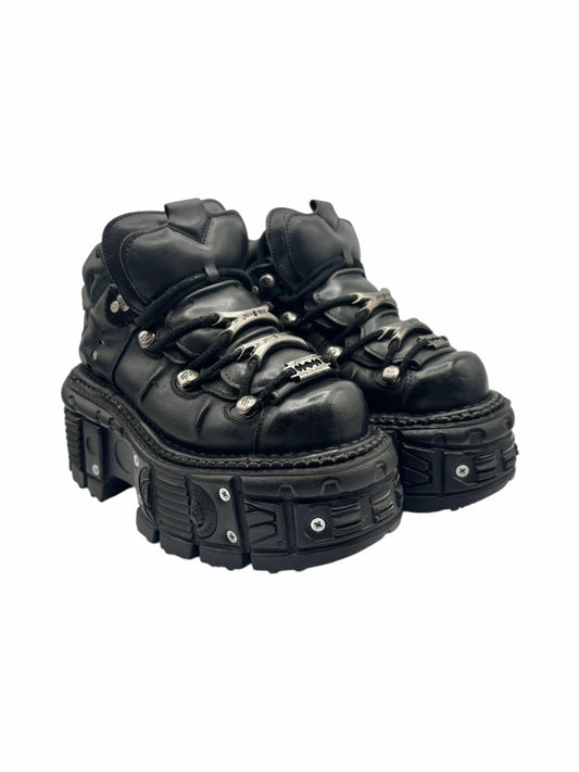 Black techno platform boots side view with lace-up panel and chunky outsole