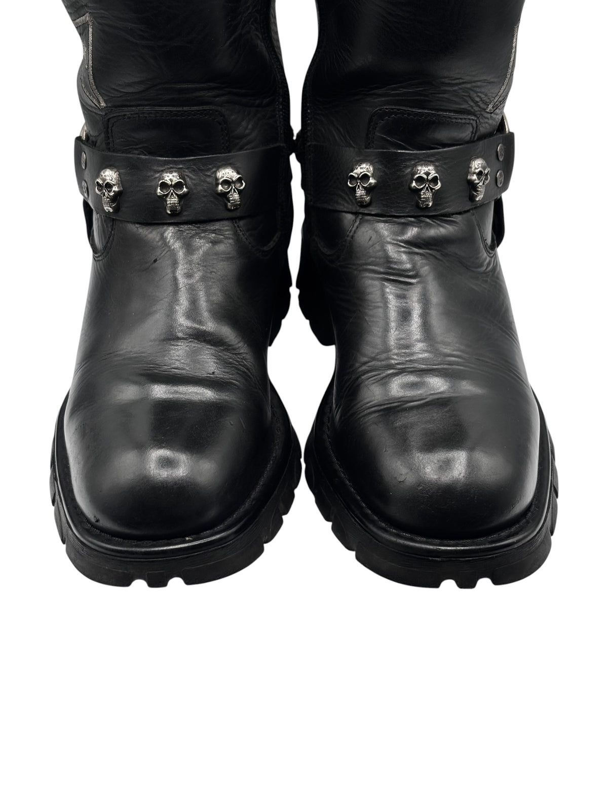 Vintage black leather biker boots with skull stud strap detail and chunky sole