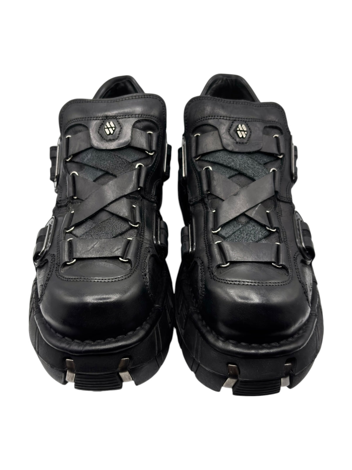 Black leather-look platform boots with buckles and lace-up strap details