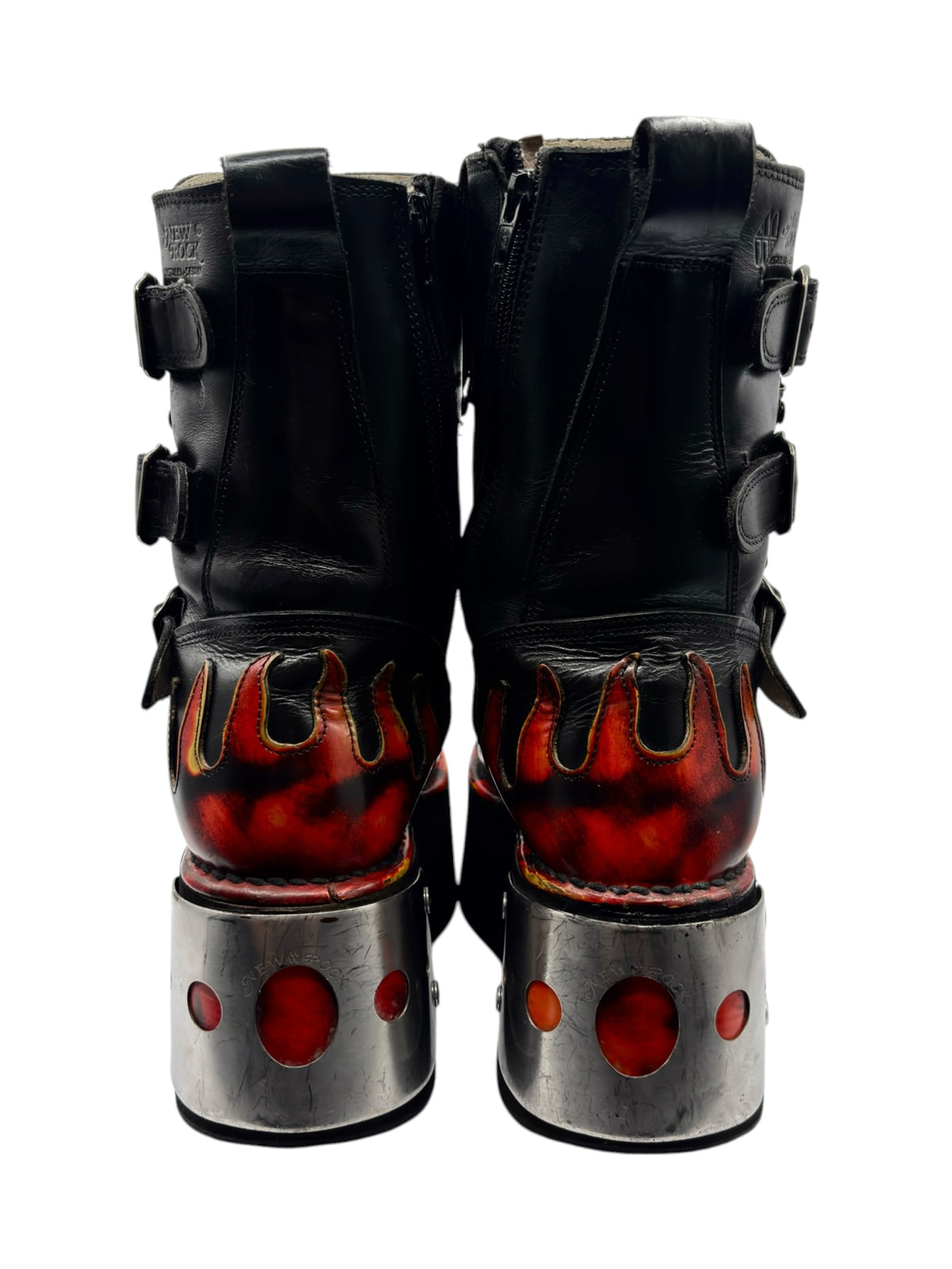 Back view of black flame platform boots with lace-up shafts and silver heel plates.