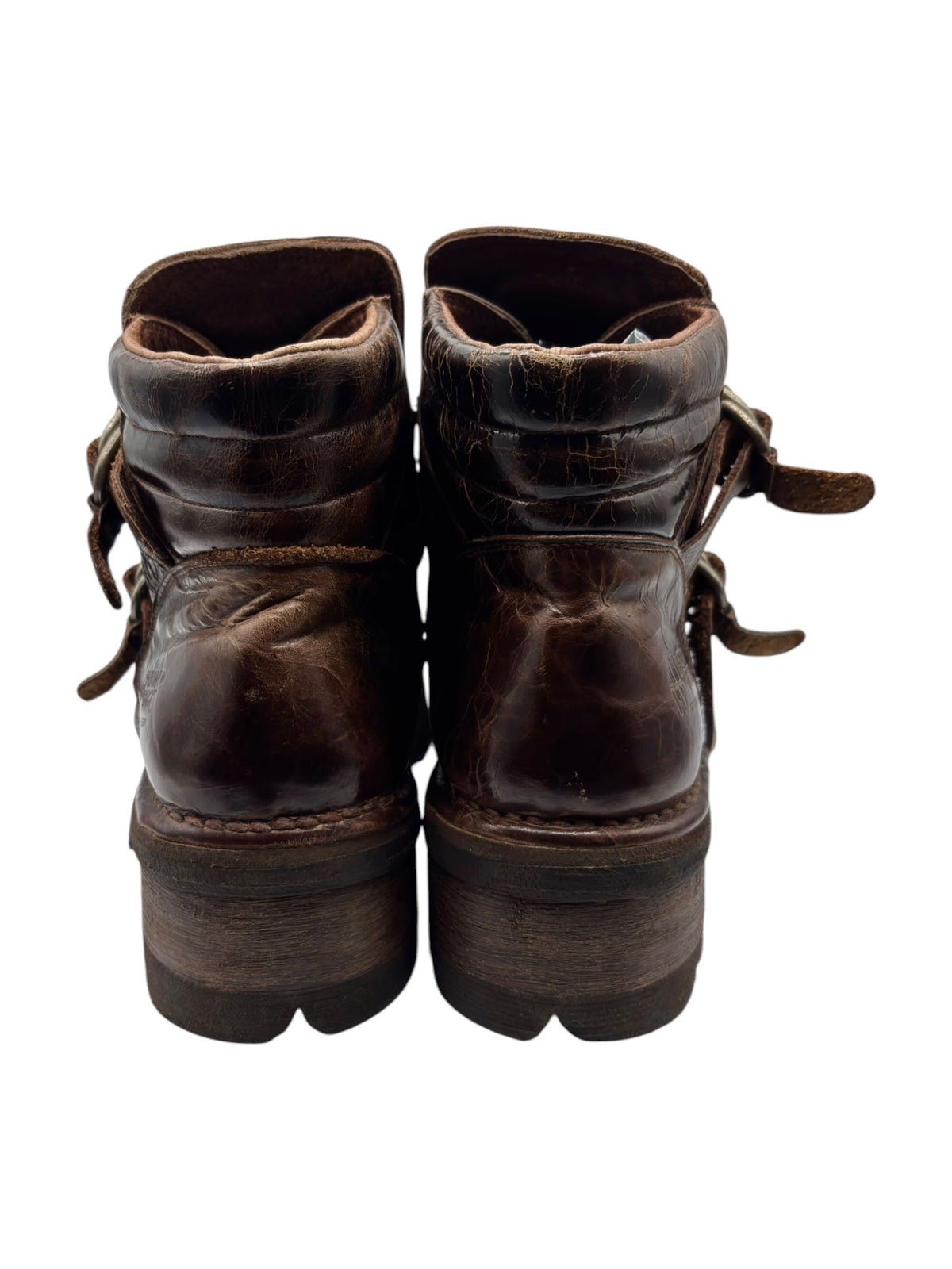 Back view of brown leather ankle boots with stacked heel and strap ties