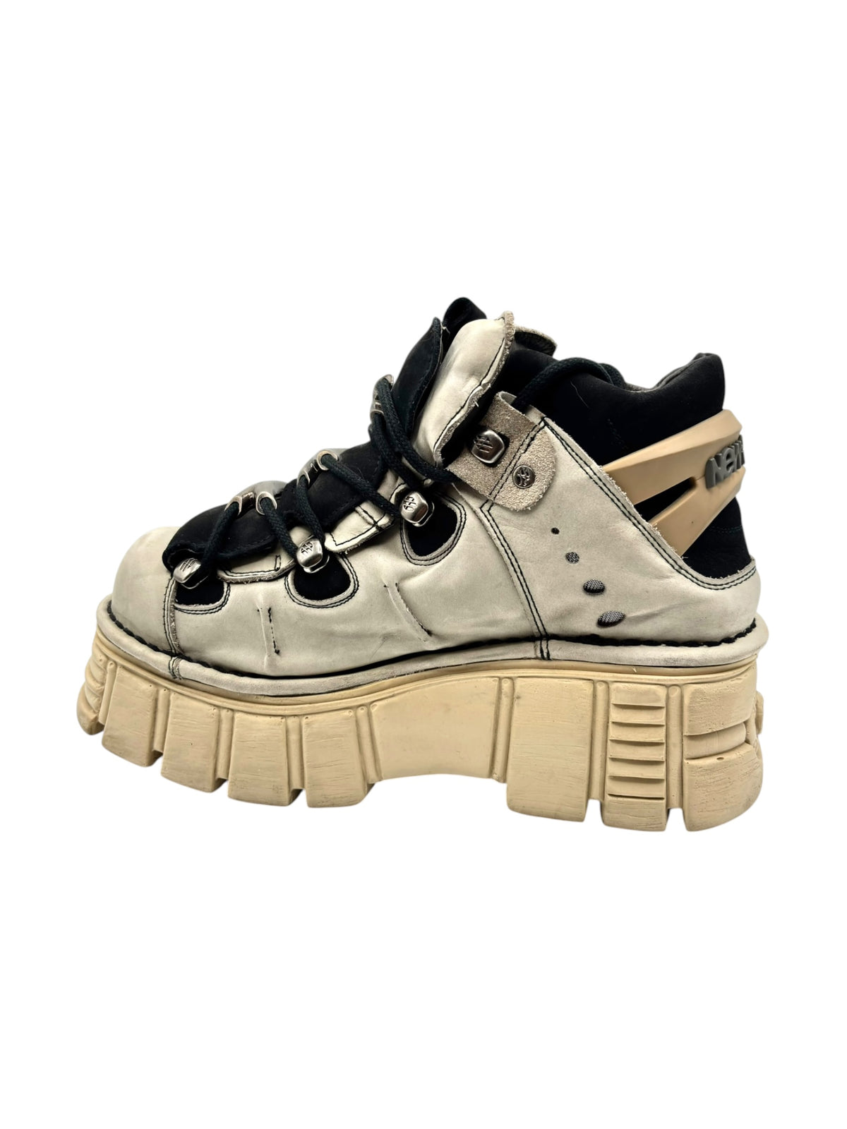 Beige and black platform sneaker-boot with lace-up front and tan lug sole