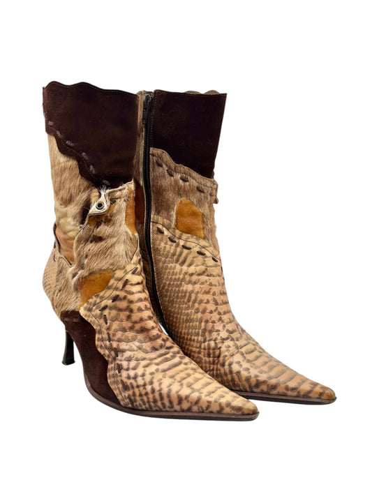 Side-by-side tan snake-pattern ankle boots with dark suede panels and stiletto heels
