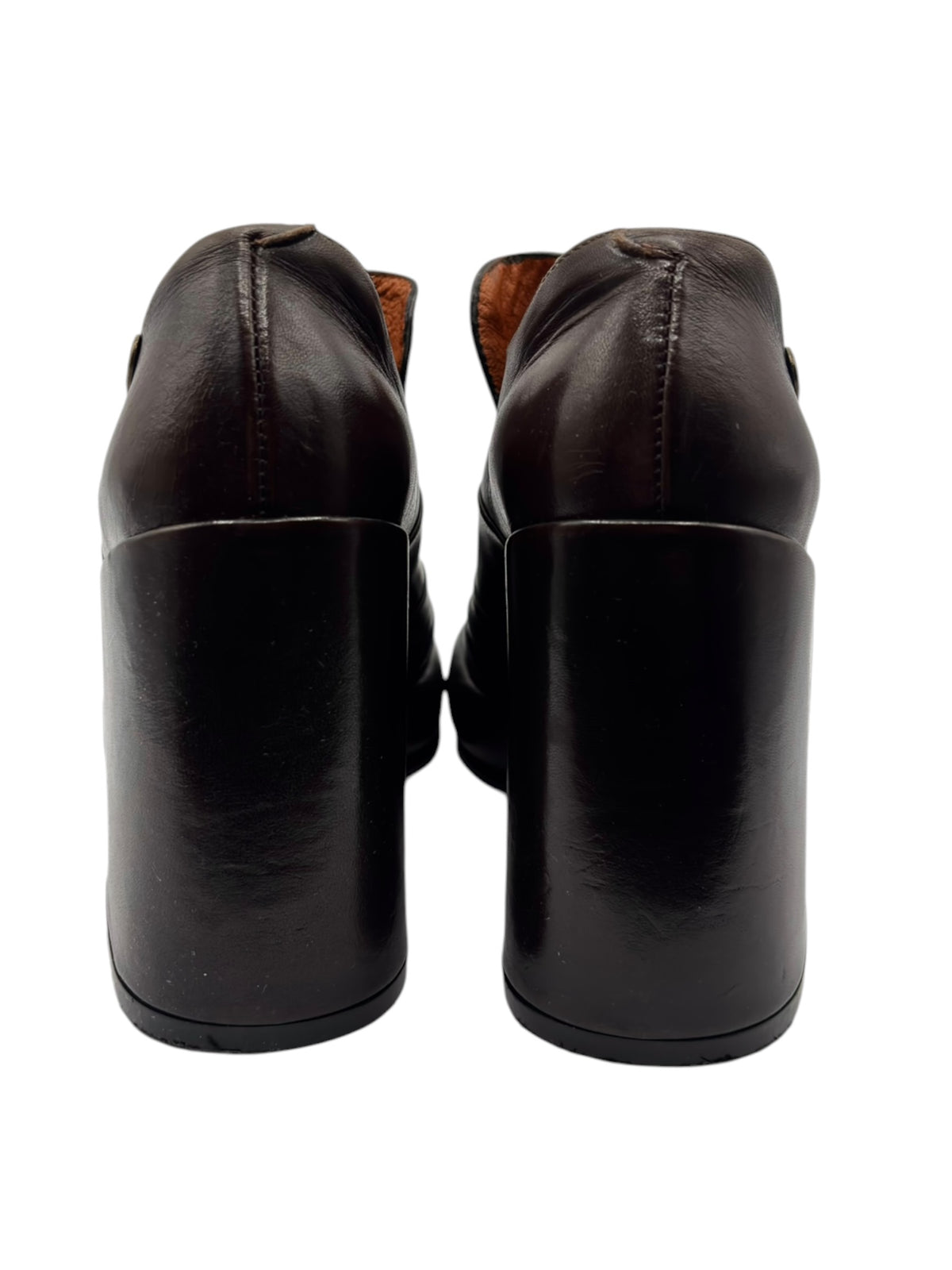 Dark brown leather heeled shoes, back view with stacked block heel and seams