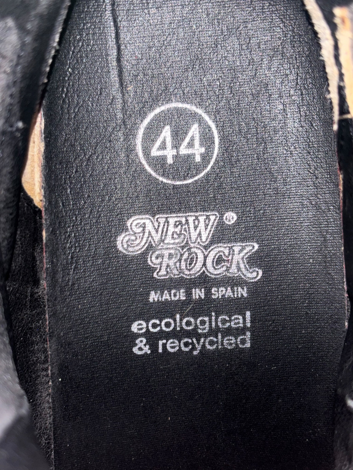 Black biker boot shaft label with New Rock branding and eco, recycled text