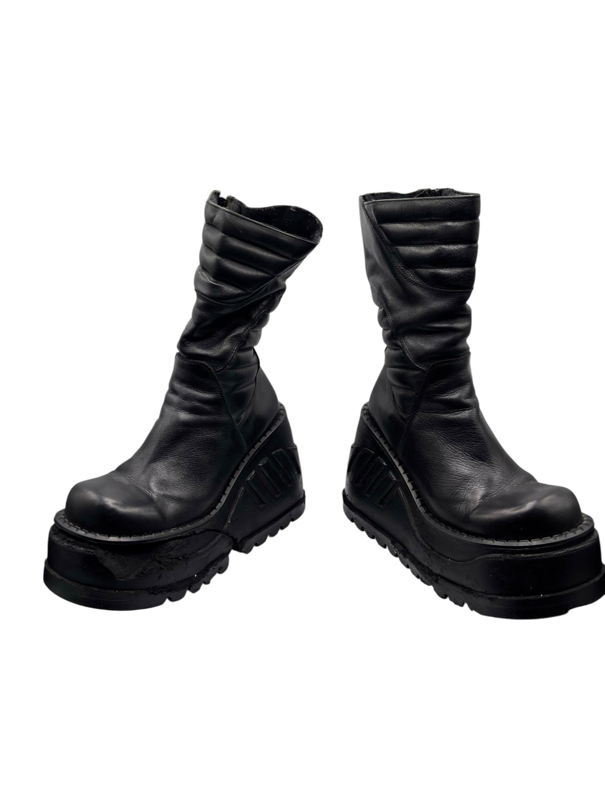 Pair of black mid-calf leather platform boots with thick lug soles