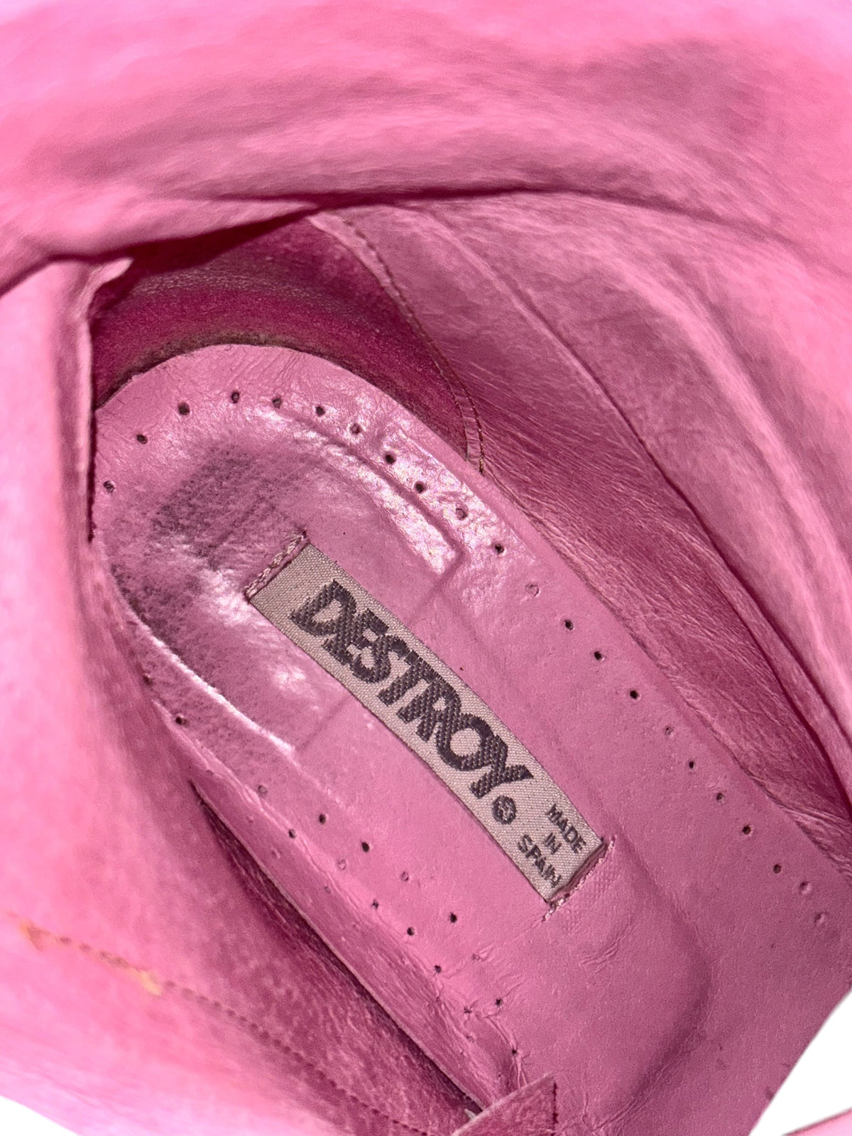 Pink leather boot interior with stitched footbed and DESTROY logo