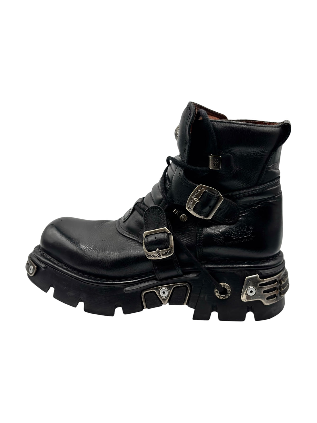 Black leather ankle boots with buckles, straps, and chunky lug sole