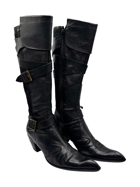 Black leather knee-high boots with pointed toe, buckled strap detail