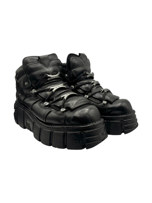 Black lace-up platform boots with thick lug sole and padded ankle