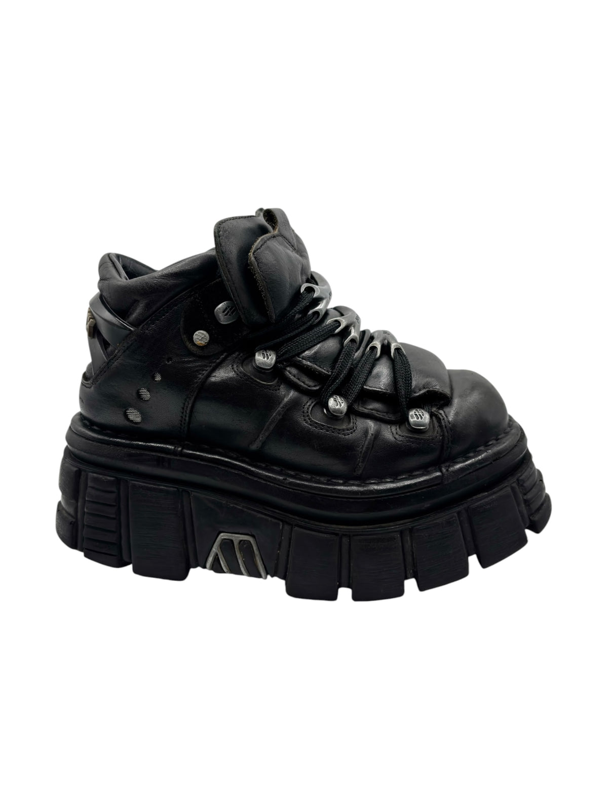 Black high-top platform boots with double buckles and rugged outsole
