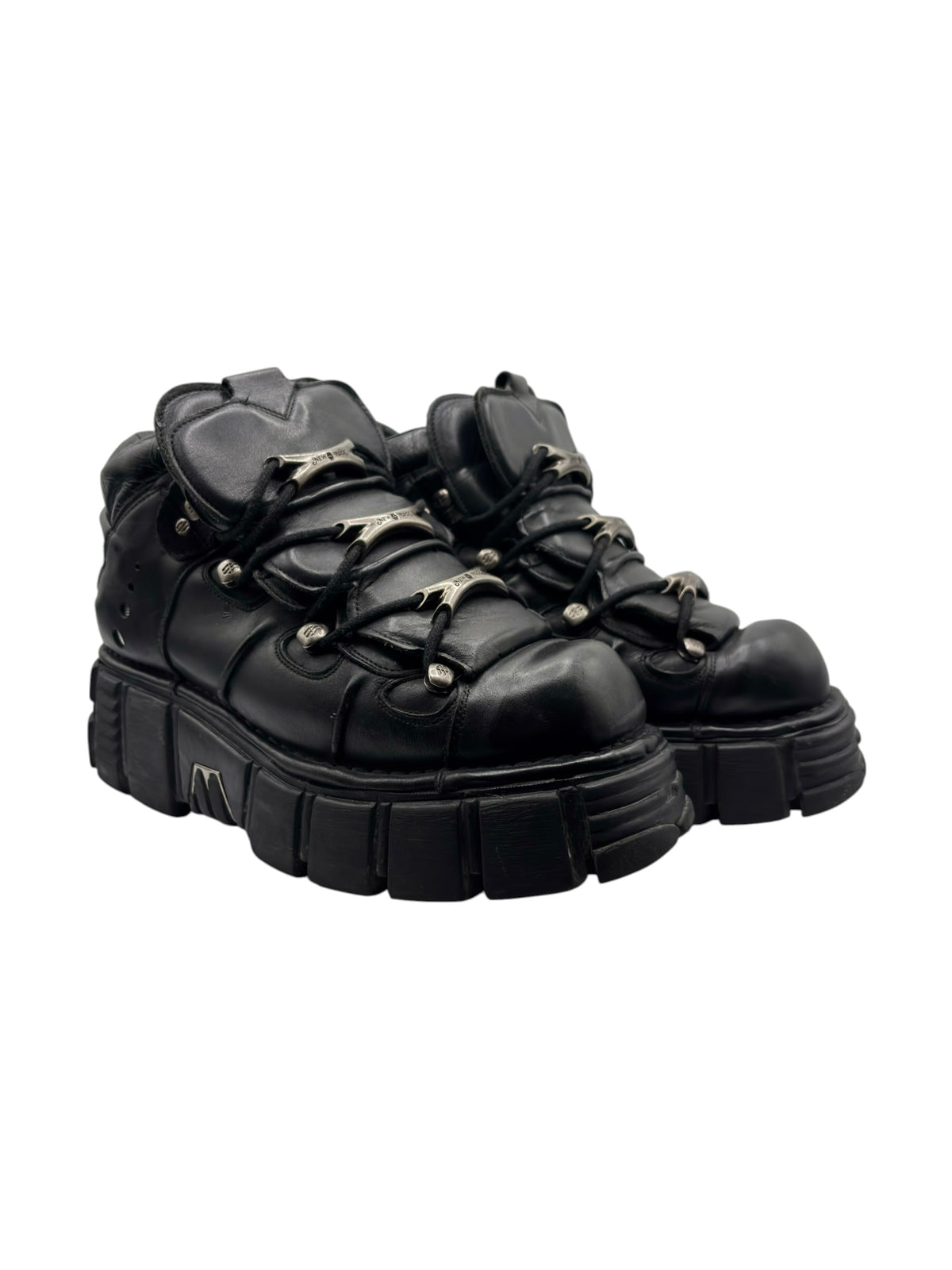Side-by-side pair of black platform boots with chunky soles and lace-up uppers