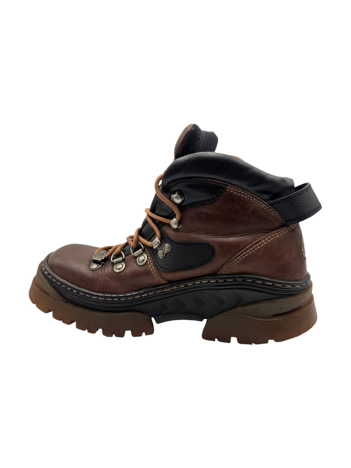 Brown leather boots with black padded collar and side overlays, rugged tread