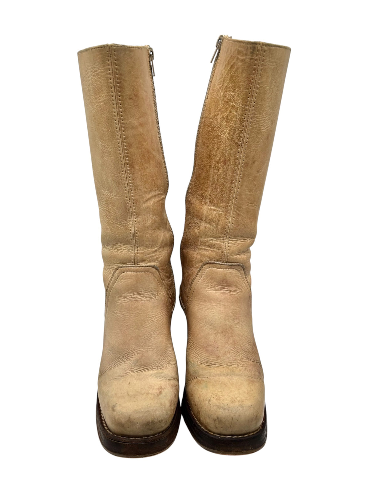 Beige knee-high leather boots with worn vintage finish and textured shaft
