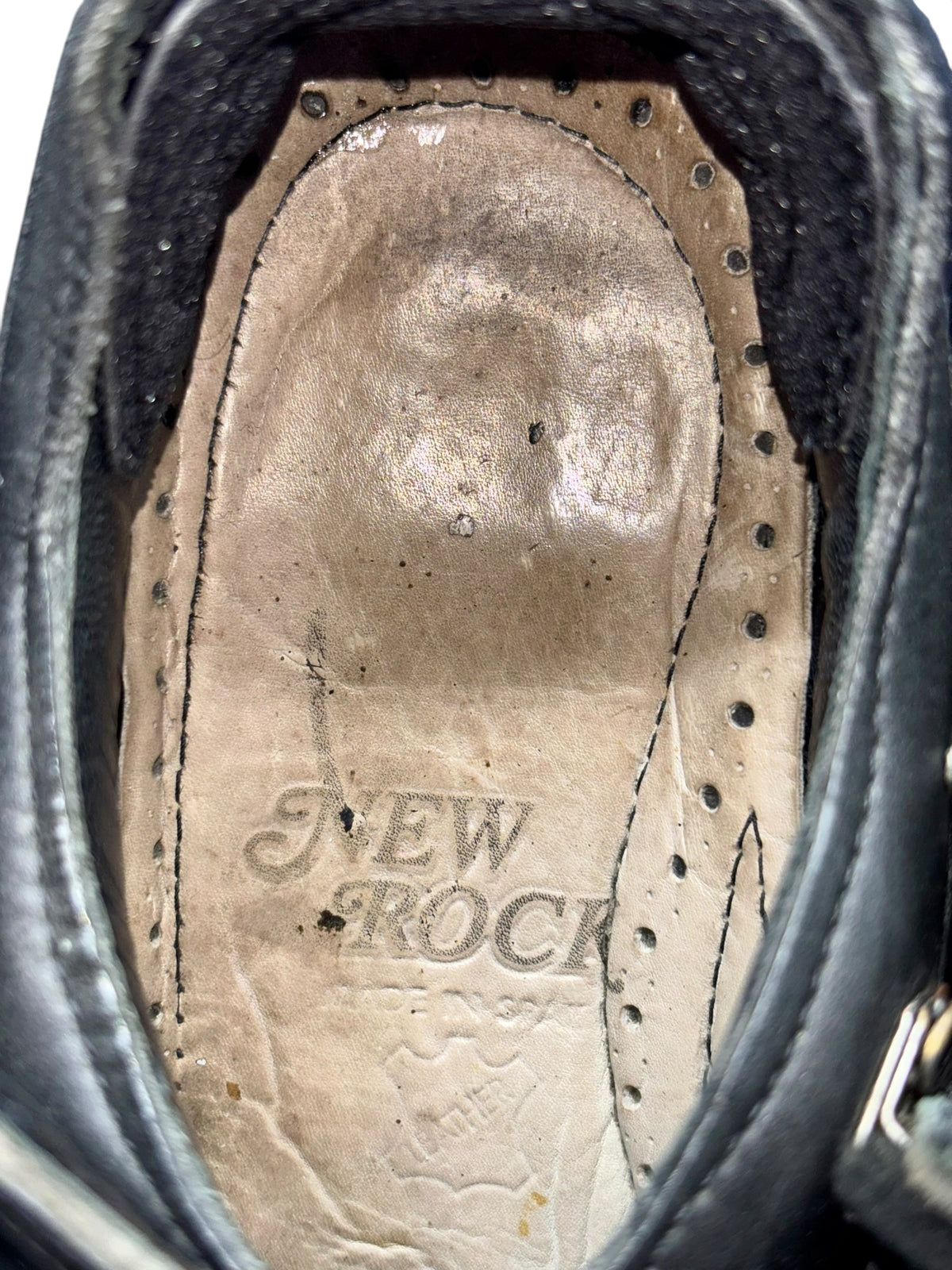 Vintage platform boots, interior view with New Rock logo on beige insole.