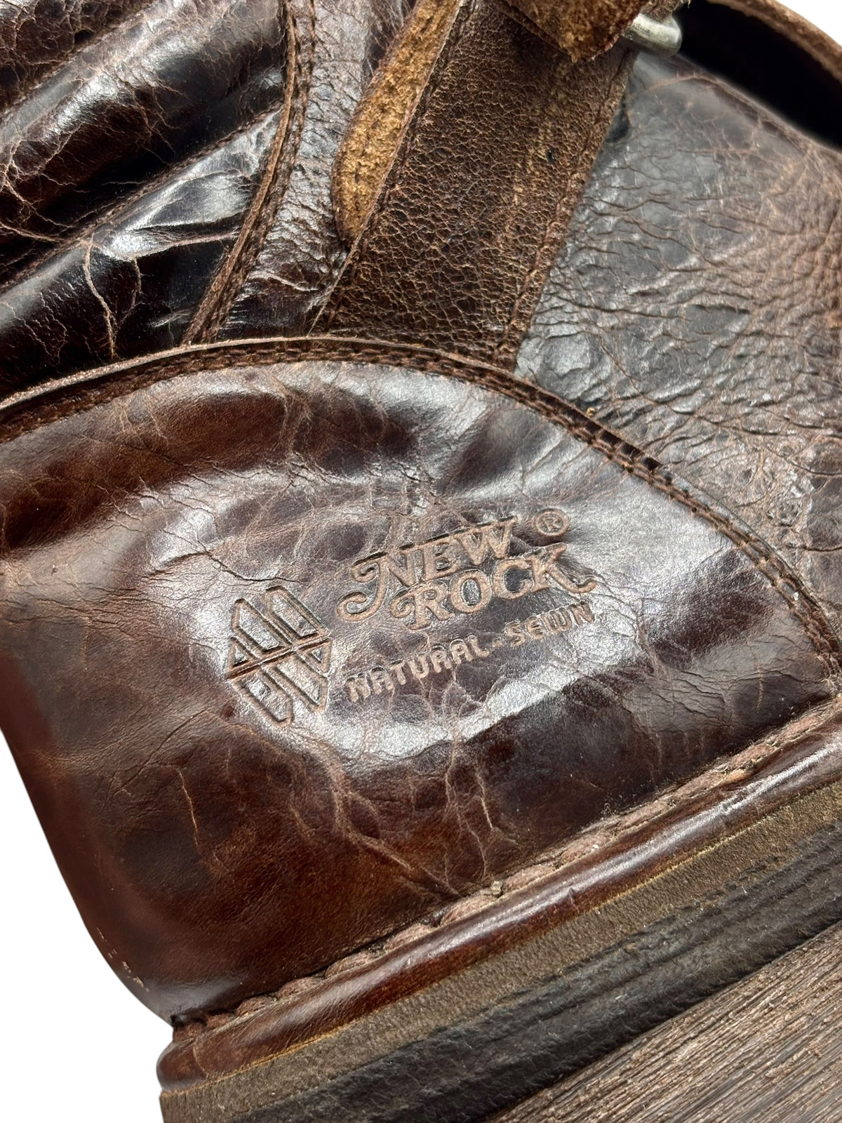 Brown leather boot side panel with embossed New Rock Natural leather mark