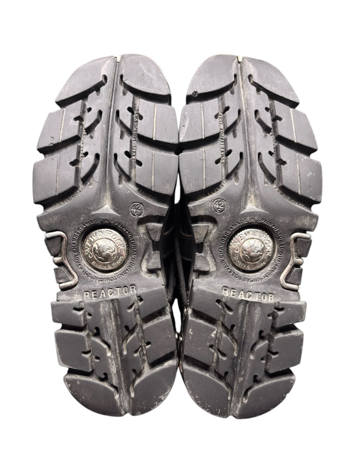 Pair of reactor platform boot soles, chunky tread with metal logo discs.