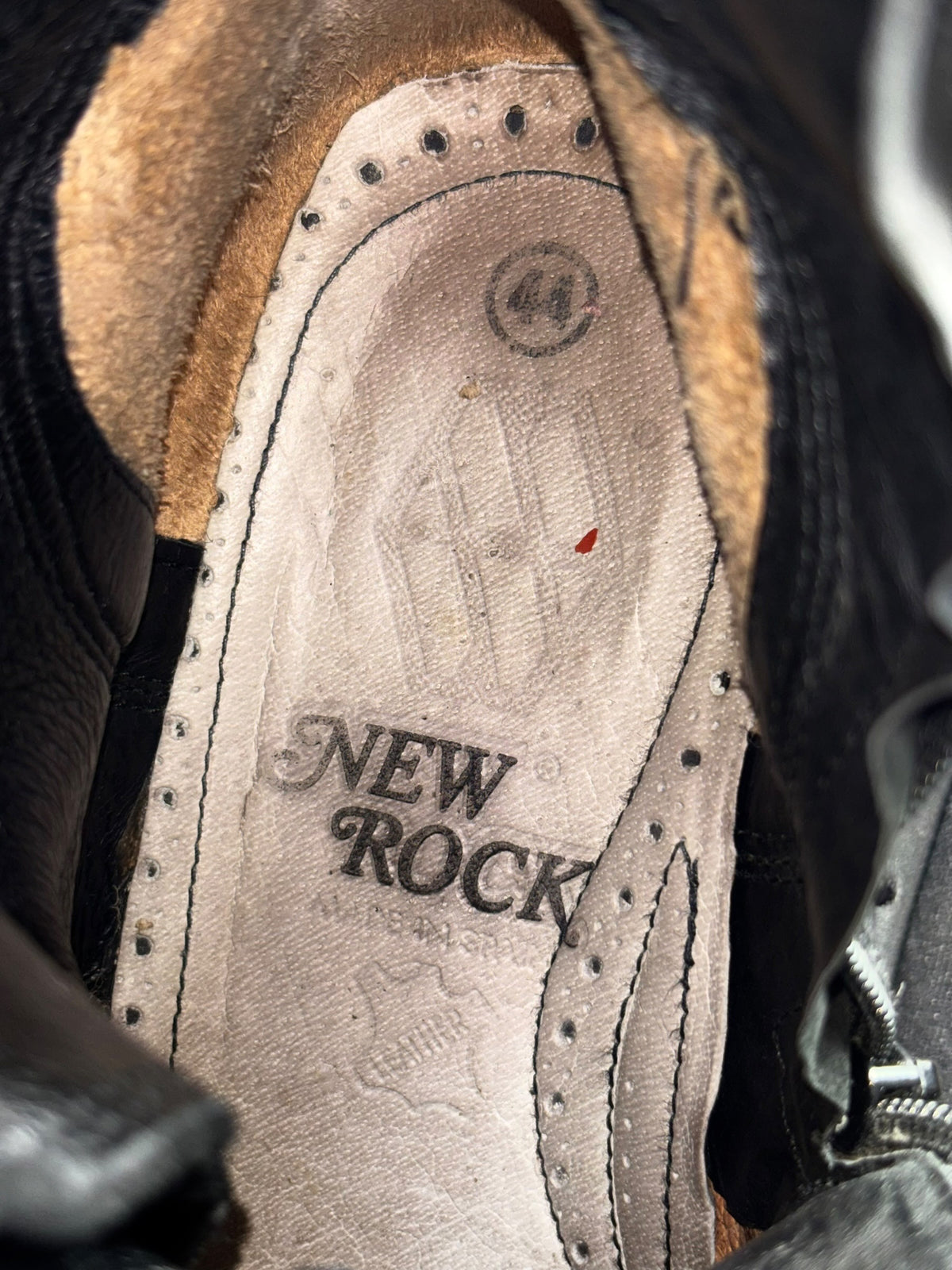Vintage black platform boots, close-up of interior lining and New Rock logo stamp