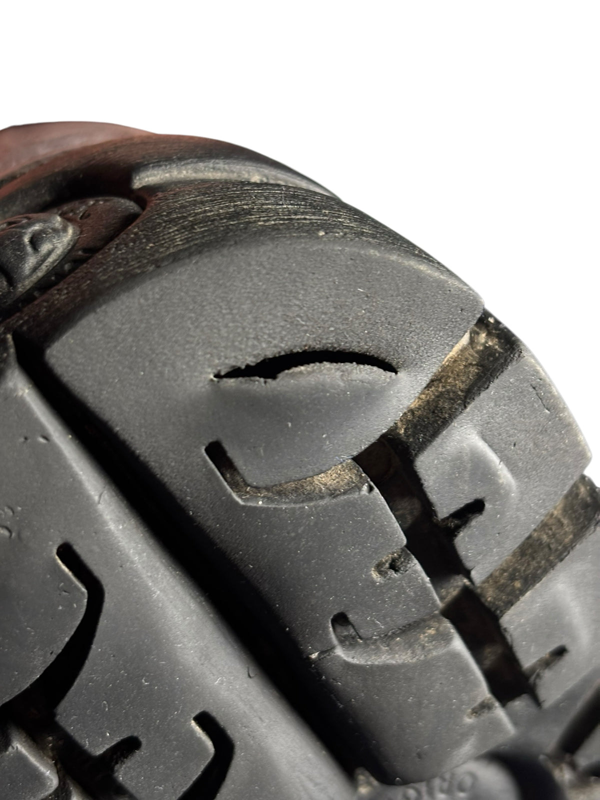Chunky platform boot outsole close-up with deep tread and molded grip shapes