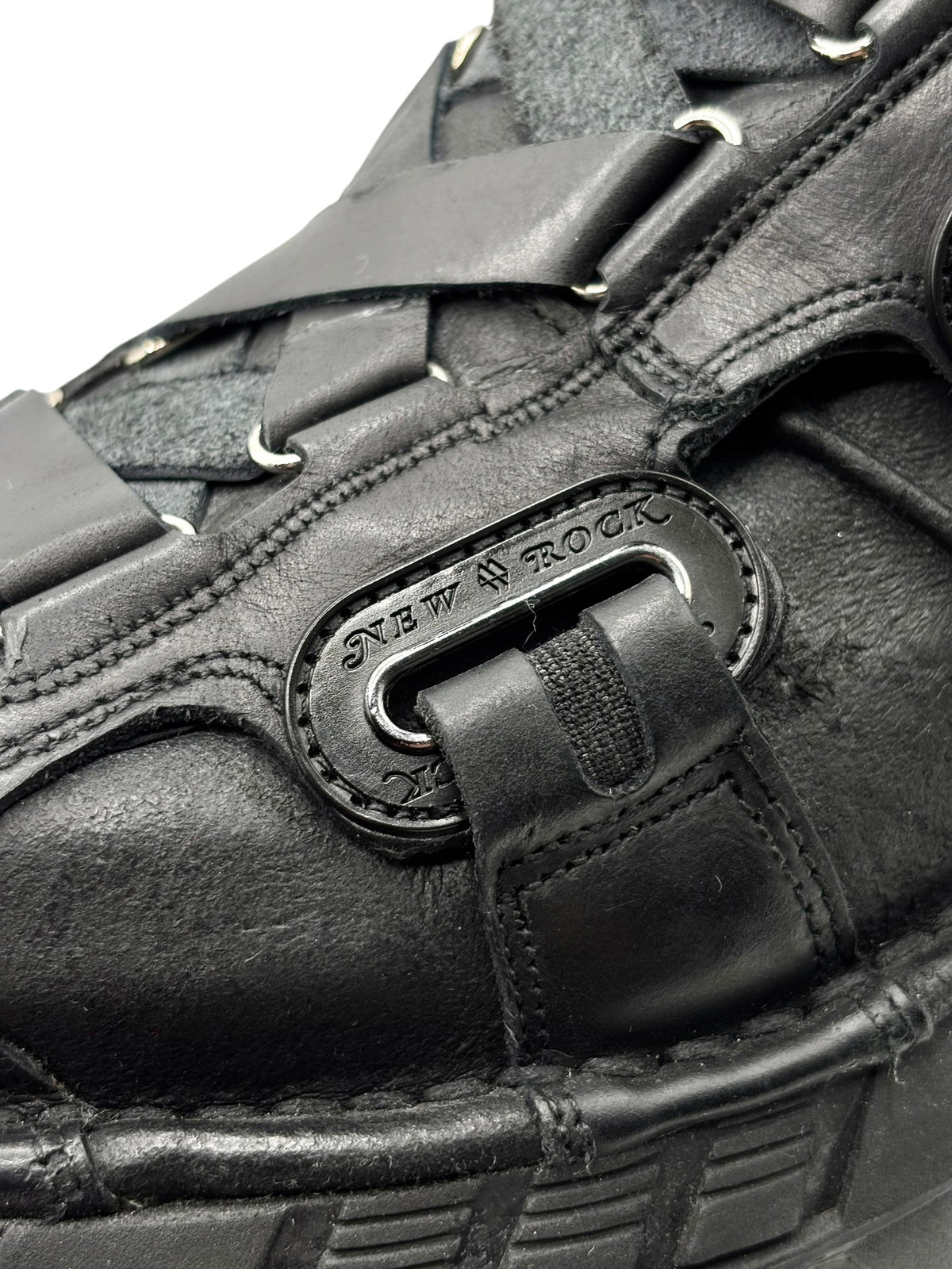 New Rock platform boot upper close-up with metal lace-buckle detail and stitching