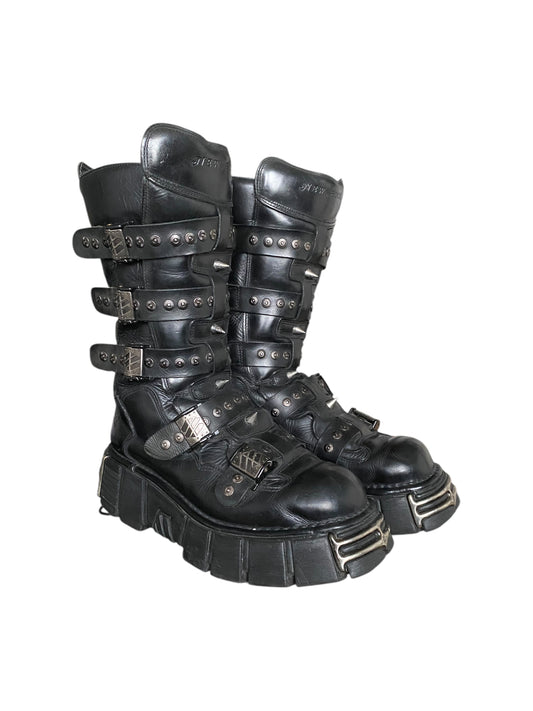 Black studded platform lace-up boots with multiple strap bands and metal buckles