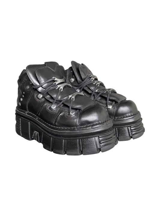 Black lace-up platform boots with chunky tread sole and stud detailing