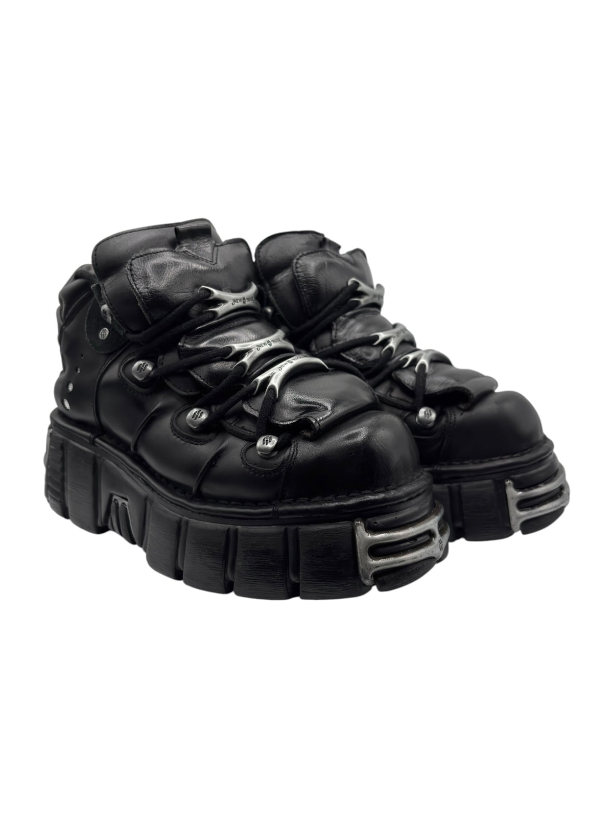Black lace-up platform boots angled side view with thick ridged sole.