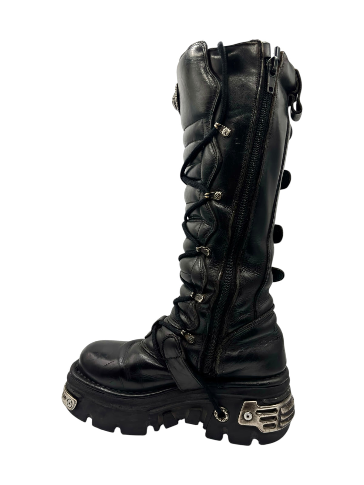 Black knee-high boots with side zipper and layered straps with metal buckles