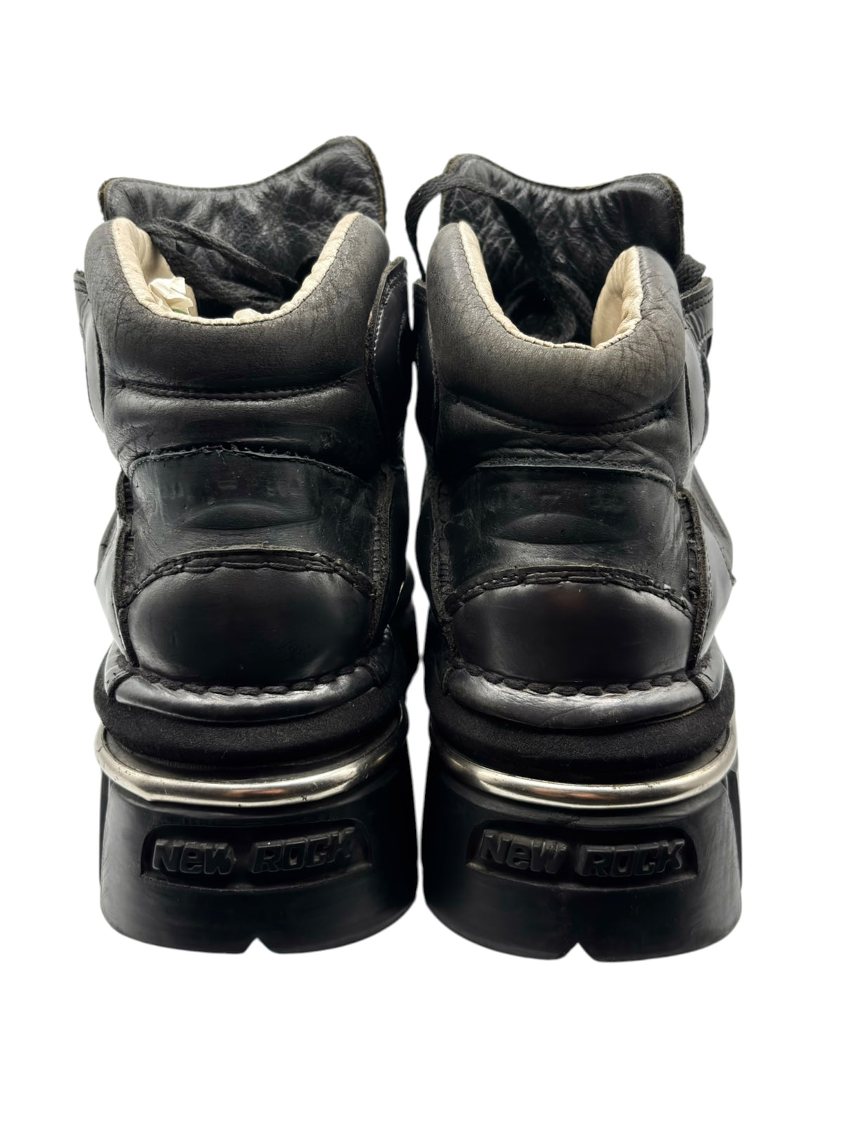 Black platform boots heel view with padded collar and New Rock logo