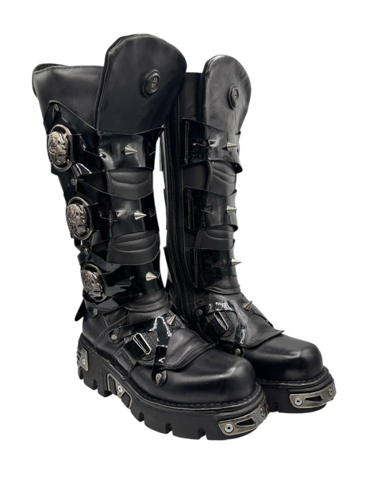 Pair of black knee-high leather boots with buckles, straps, and silver studs on shins.