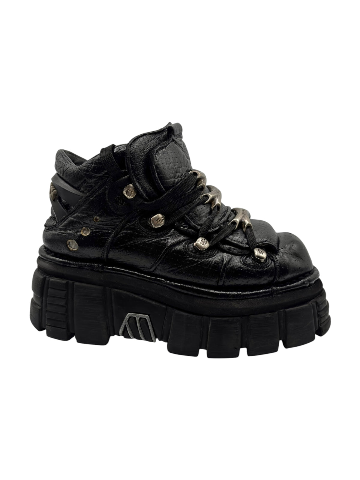 Black lace-up platform boots with chunky sole and metal-ring lace tips