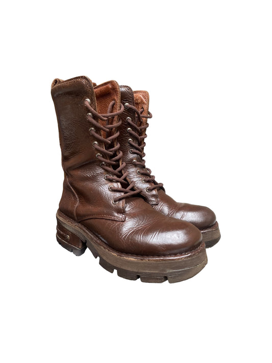 Brown lace-up leather ankle boots with thick tread sole and side pull tab