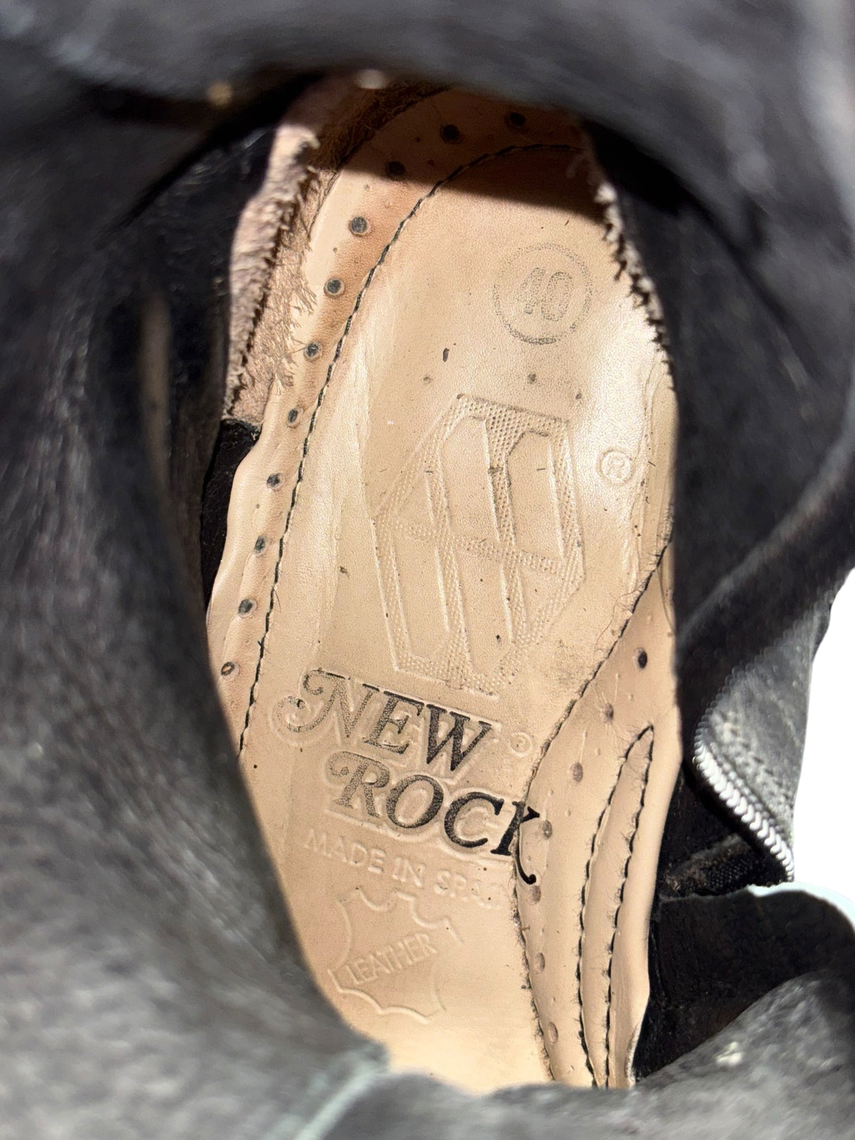 Vintage studded chain boots with tan leather interior and stitched lacing eyelets