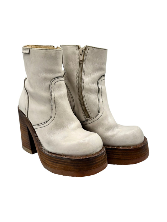 Cream ankle boots with side zipper, stacked platform, and block heel