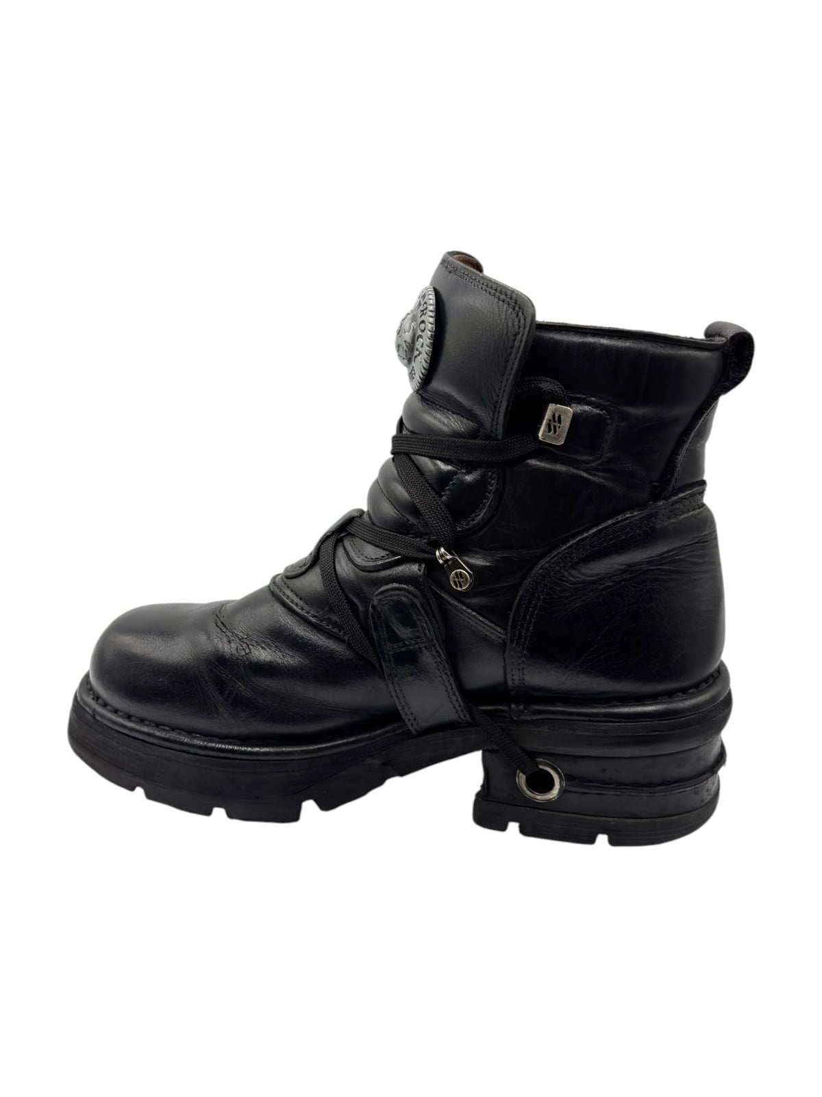 Black vintage raised-heel leather boots side view with strap and buckle