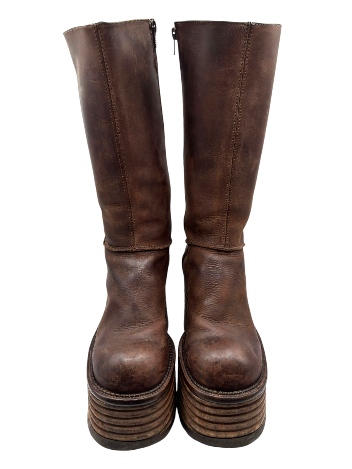 Brown knee-high leather platform boots with side zipper and stacked heel