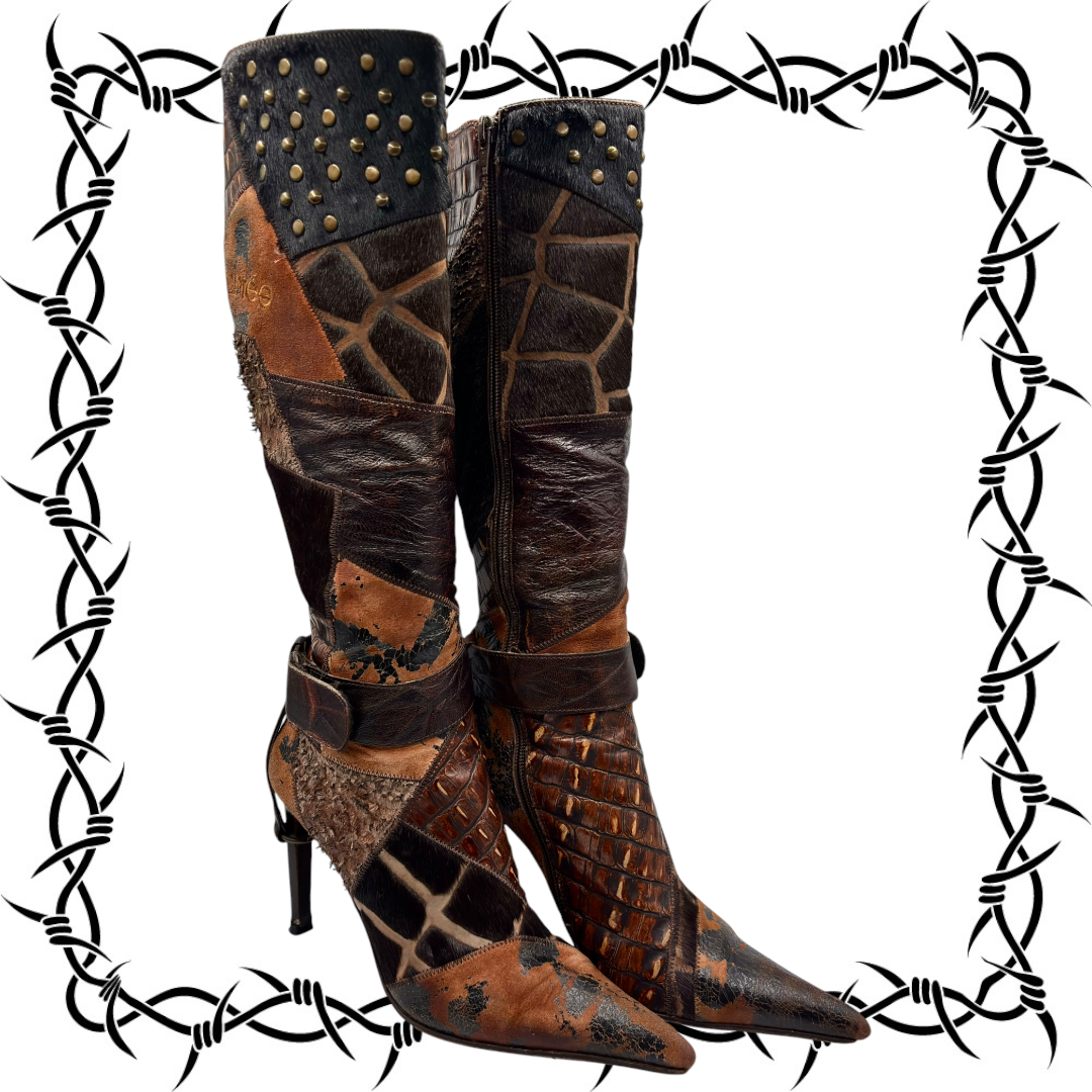 Knee-high patchwork boots with black studded cuffs, curved ankle straps, and stiletto heels.