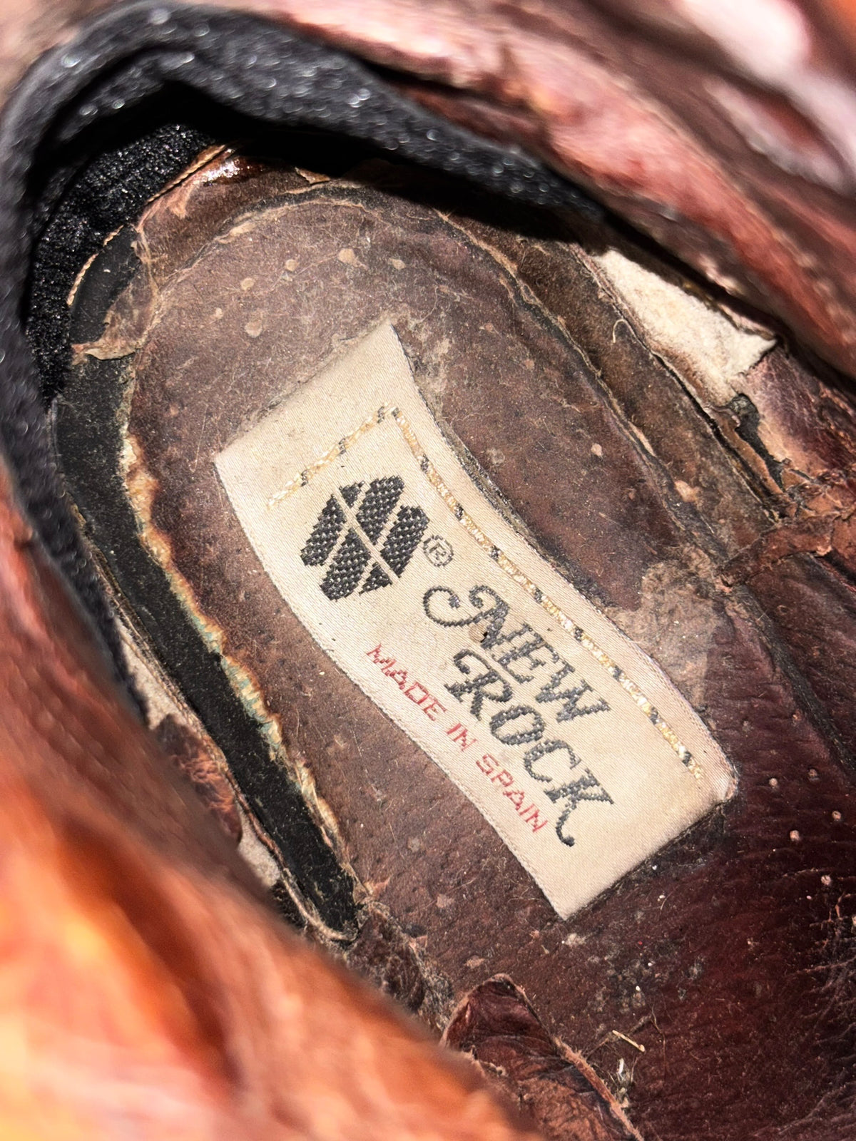 Vintage raised-heel leather boots interior label close-up