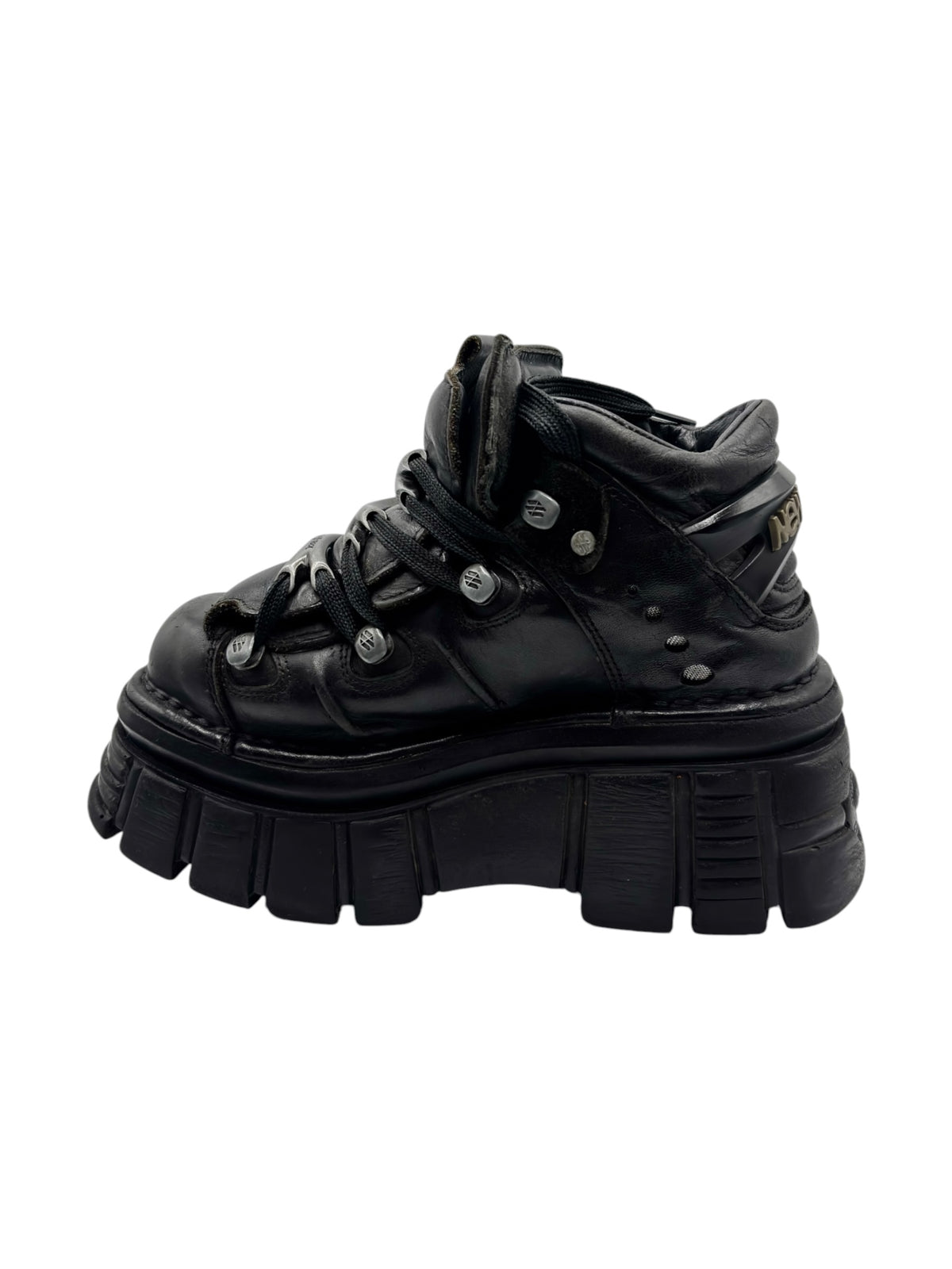 Black lace-up platform boots with thick treaded sole and side straps