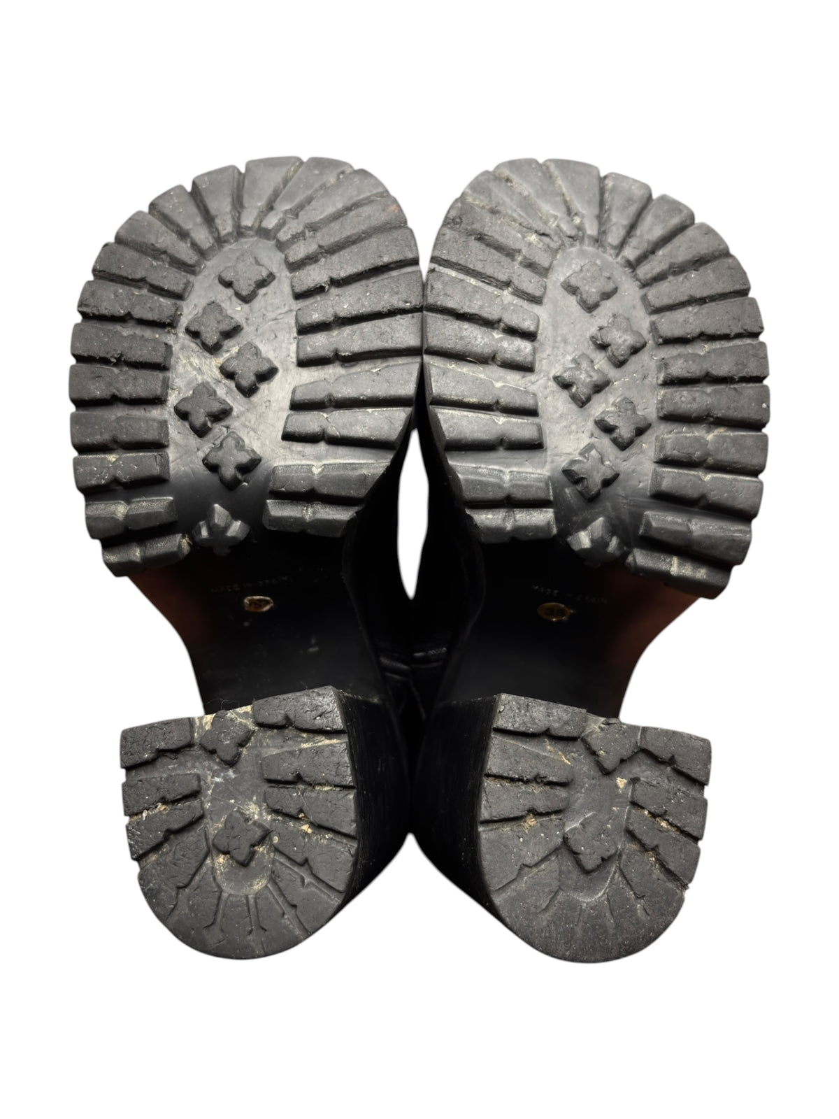 Pair of black platform boot soles with textured tread